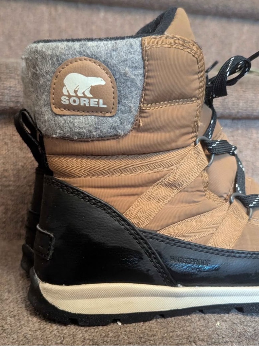 Sorel Tan and Black Lace-Up Winter Boots